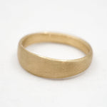 Gold ring on a white background