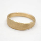 Gold ring on a white background