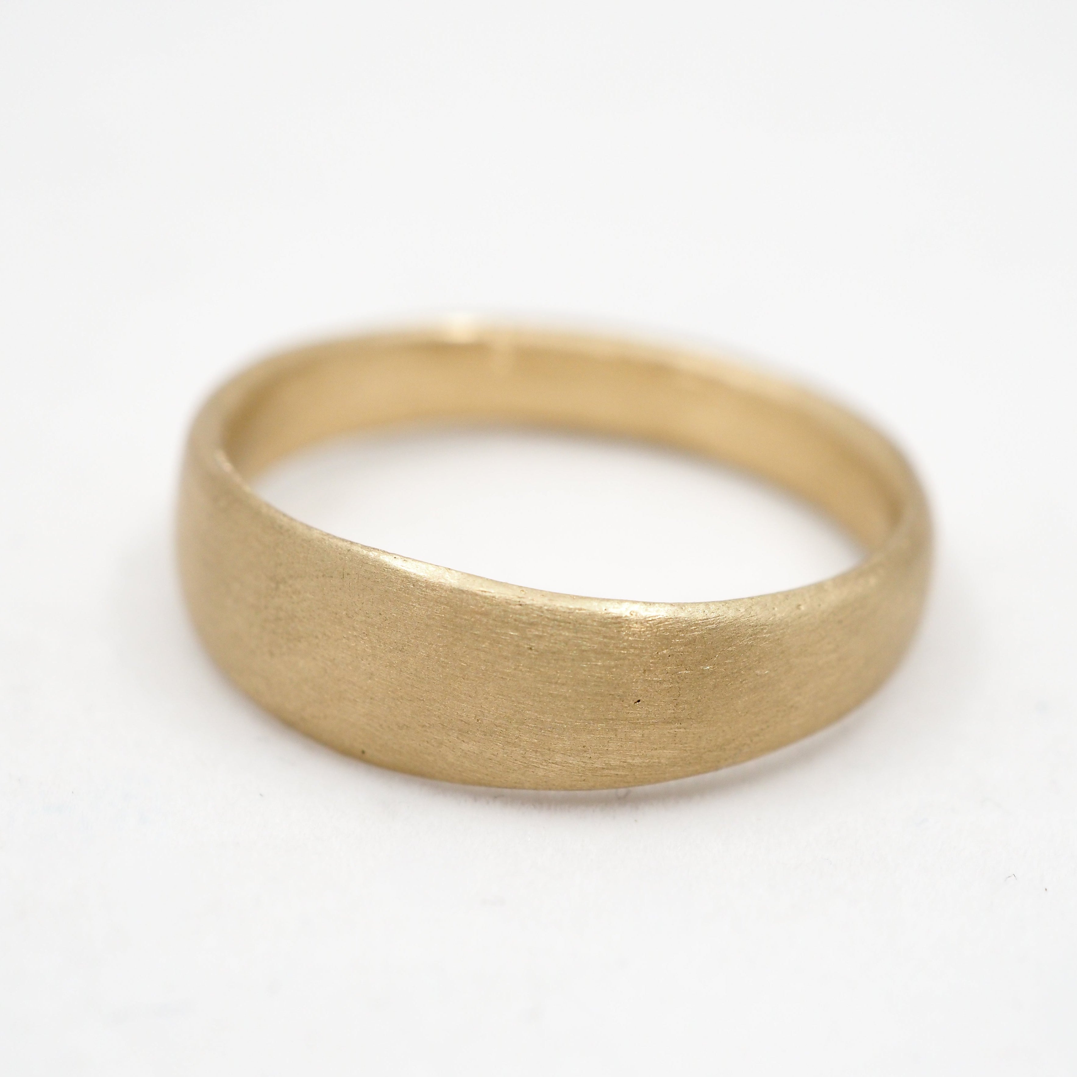 Gold ring on a white background