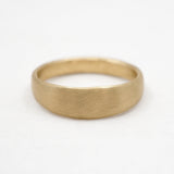 Gold ring on a white background