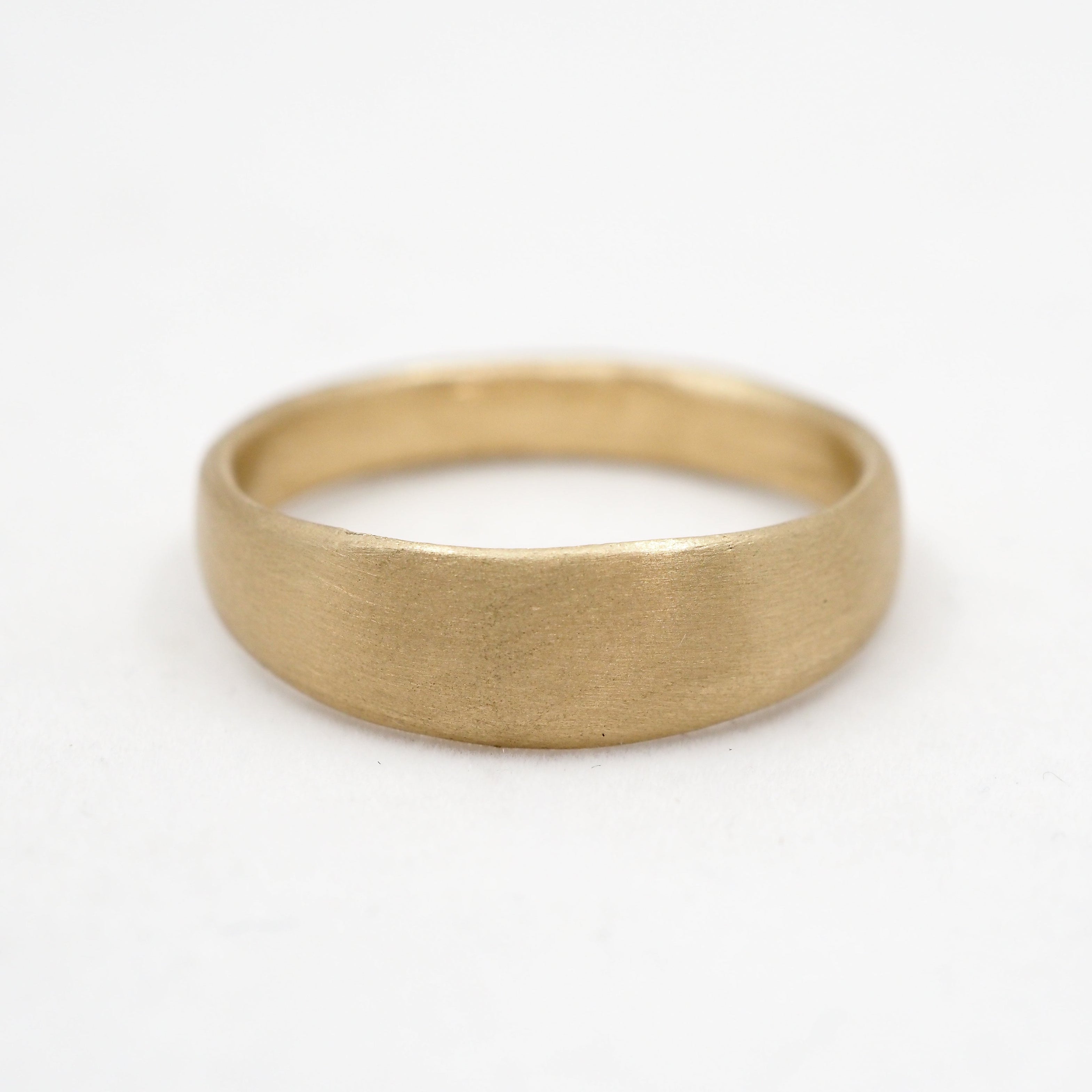 Gold ring on a white background