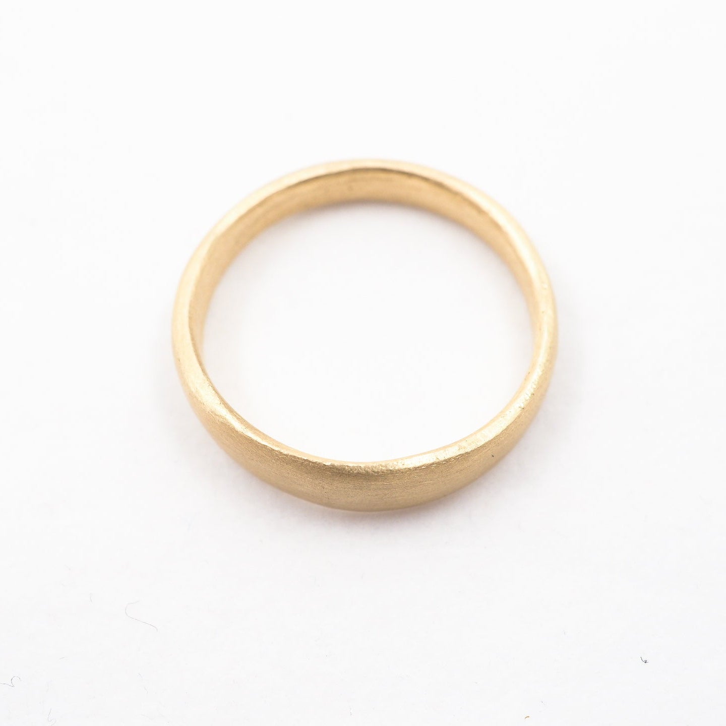 Gold ring on a white background