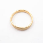 Gold ring on a white background