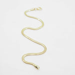 Gold chain bracelet on a white background