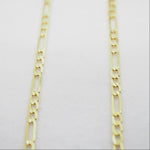 Gold chain on a light gray background