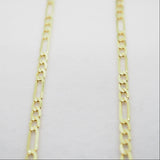 Gold chain on a light gray background