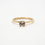 Gold ring with a morganite on a white background