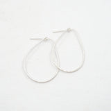 Silver hoop earrings on a white background