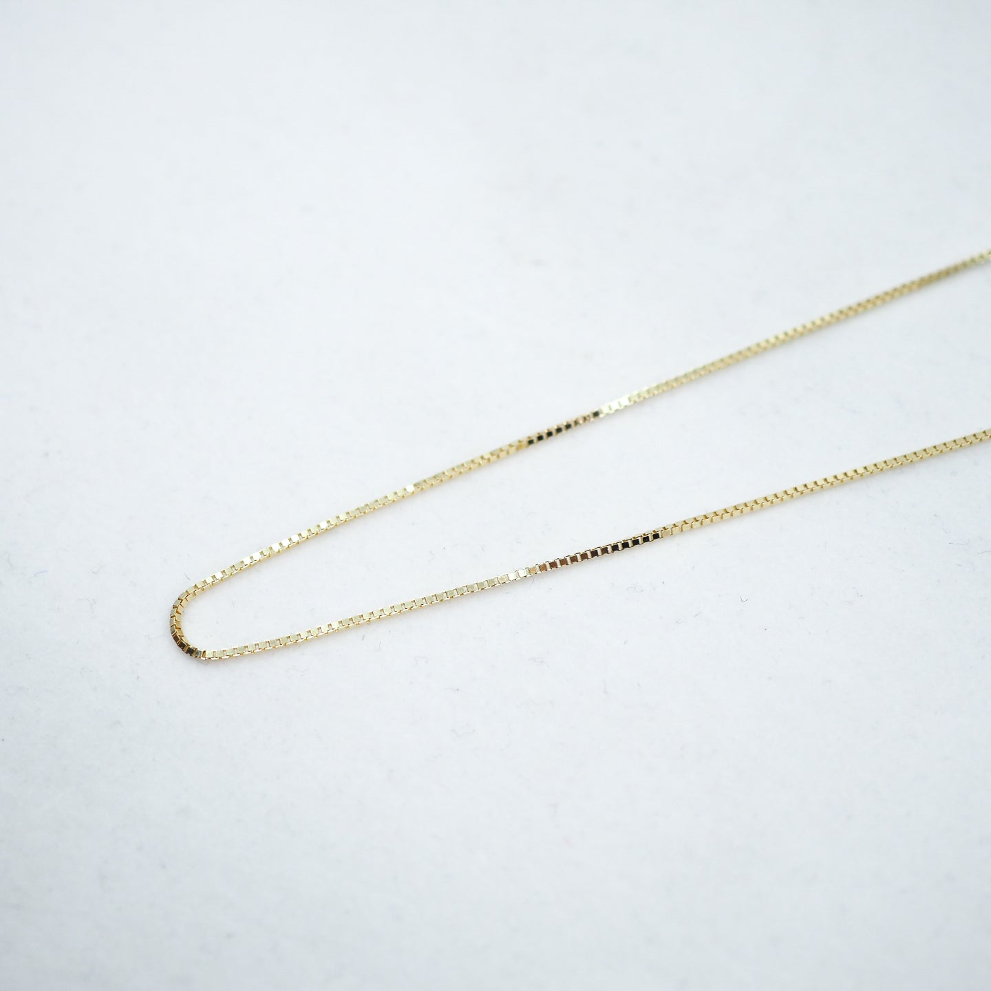 Gold chain on a white background