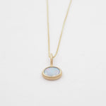 Necklace with a pendant on a light gray background