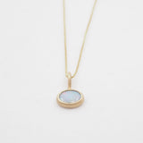 Necklace with a pendant on a light gray background