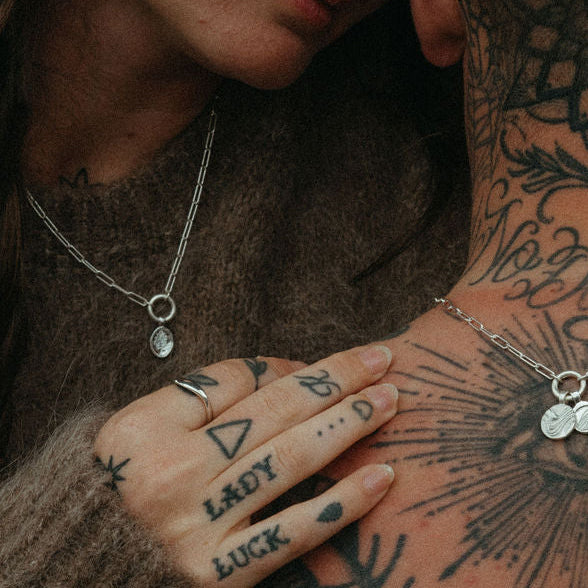 Couple embracing with tattoos on their skin
