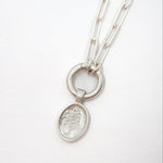 Silver necklace with the Lupine pendant on a white background