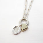 Necklace with heart and Lupine pendant on a white background