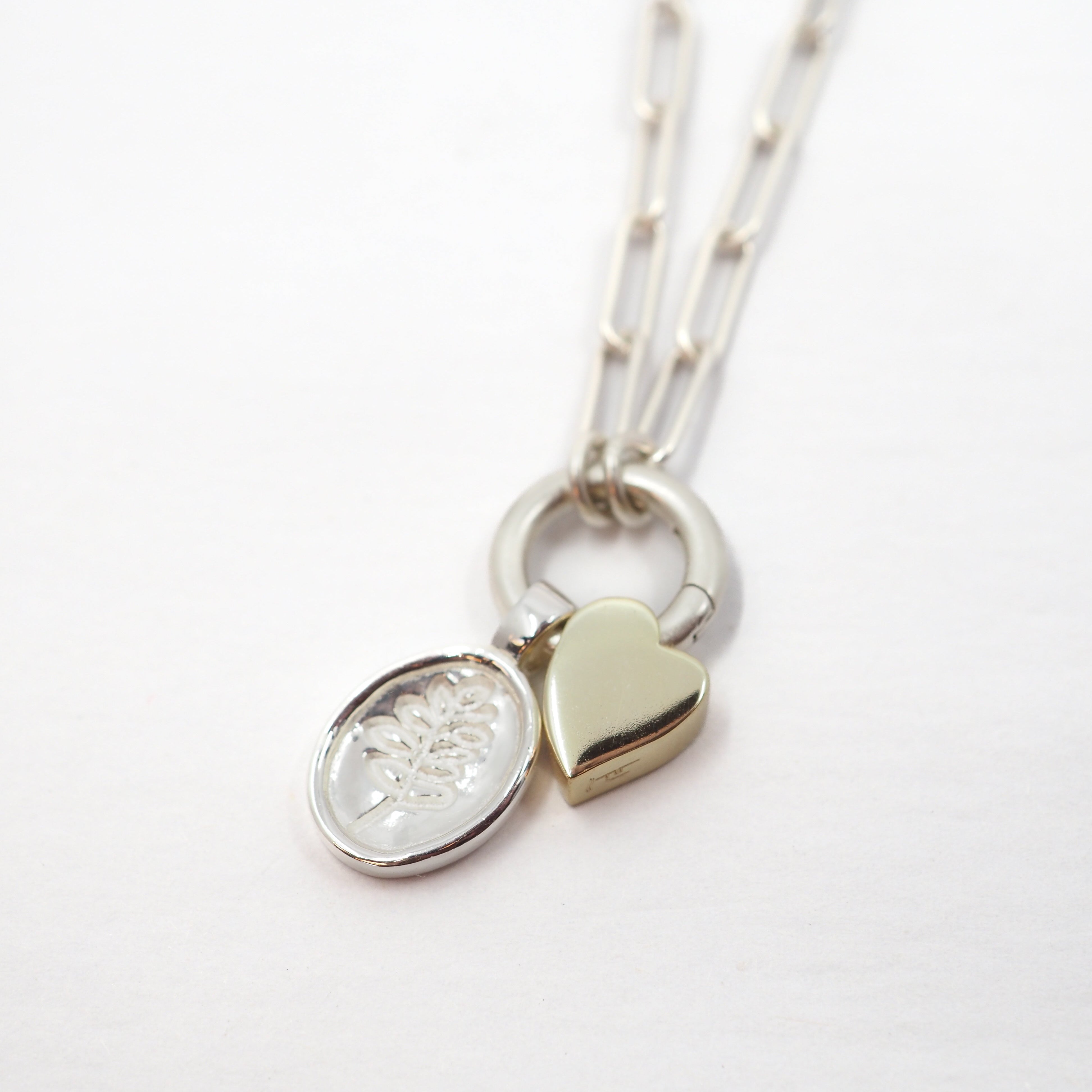 Necklace with heart and Lupine pendant on a white background