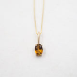 Collier ovale en or 10 carats avec pierre de lune et motif de soleil