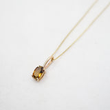 Collier ovale en or 10 carats avec pierre de lune et motif de soleil