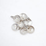 A cluster of textured silver disk charms with small hanging loops, displayed on a clean white background.