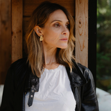 Woman looking to the side with gold earrings