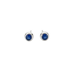 Silver earrings with blue gemstones on a light gray background